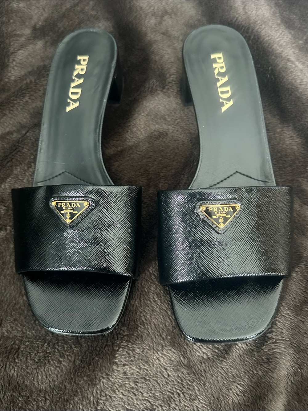 Prada Black Leather Slide Mules with Gold Logo